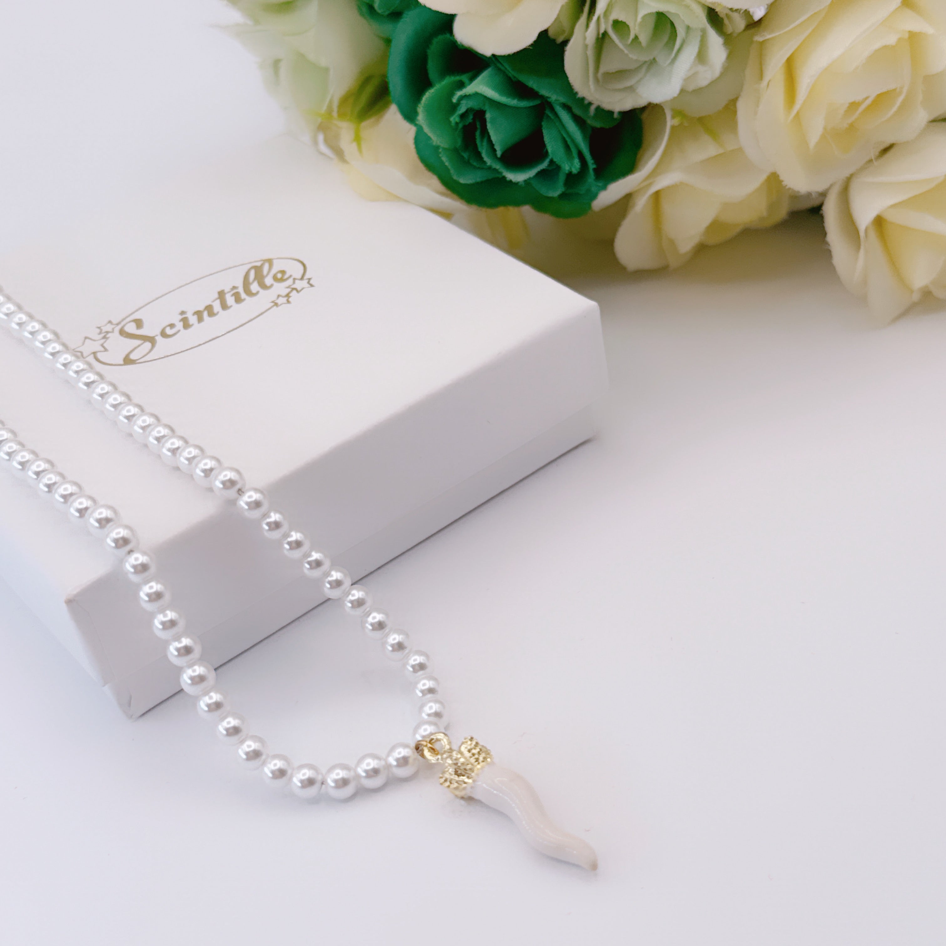 Collana Perline & Corno Reale